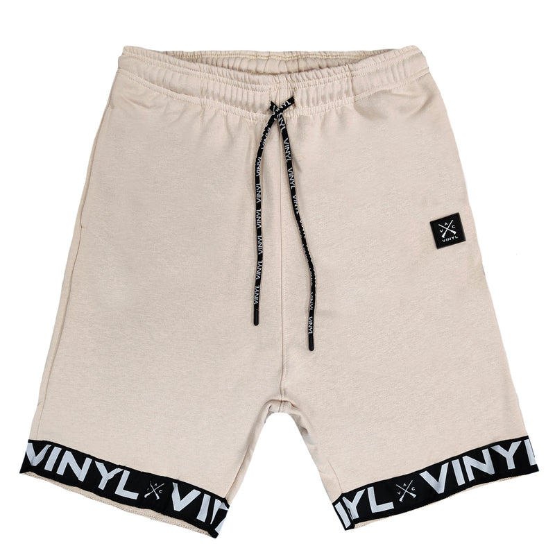 Vinyl art clothing beige shorts with logo tape